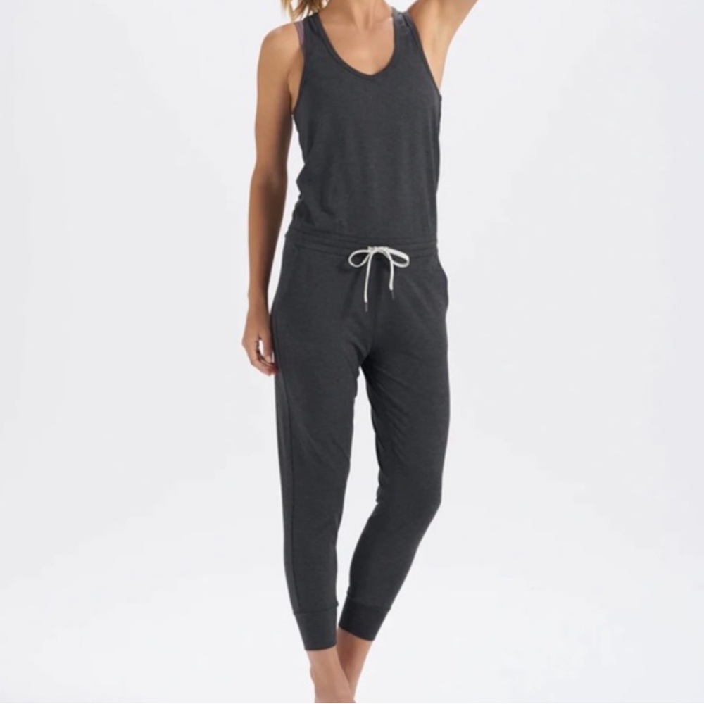 Never worn, tags removed. Vuori dark gray jumpsuit in size small.